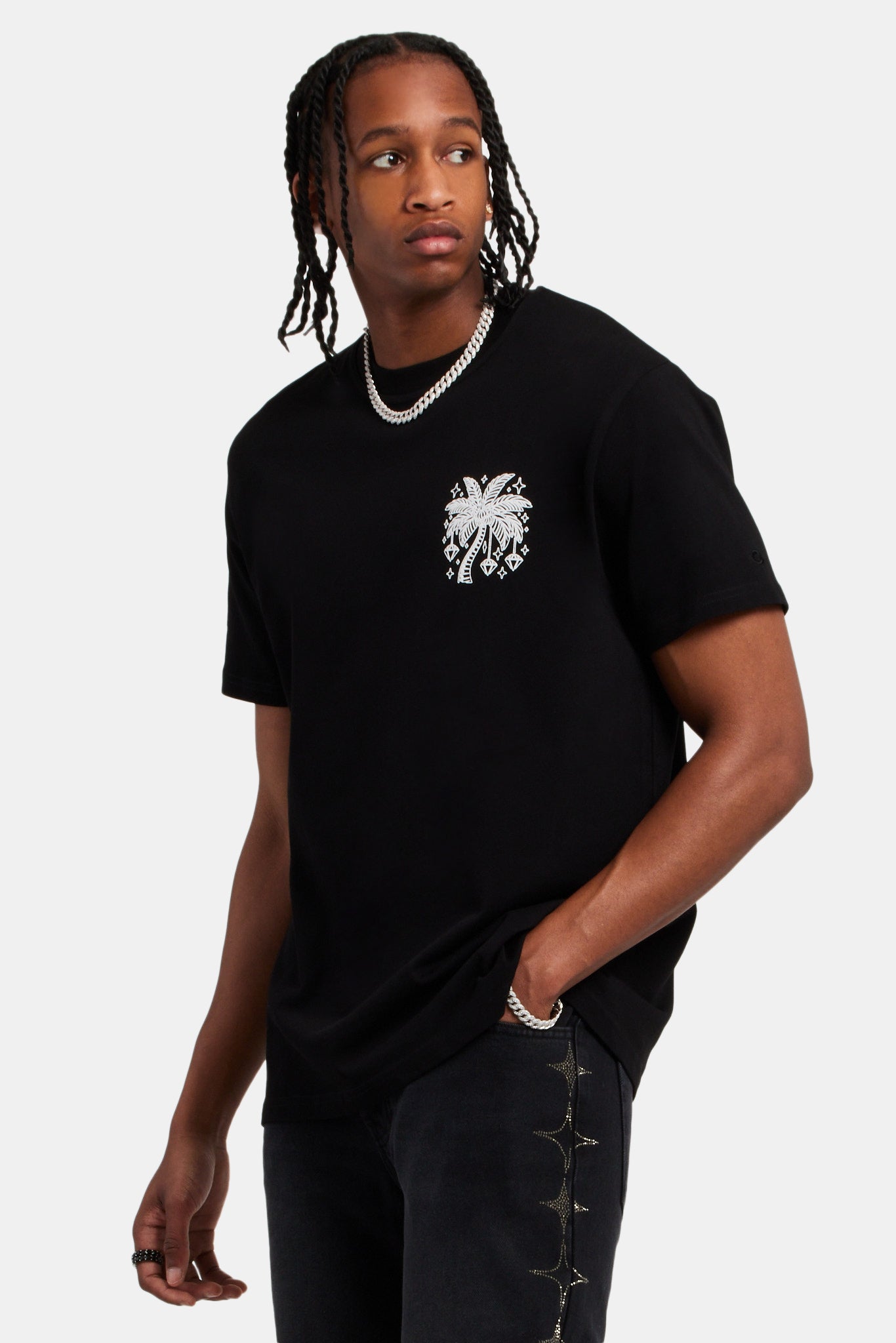 Male model wearing the Diamond palm outline oversized t-shirt in balck